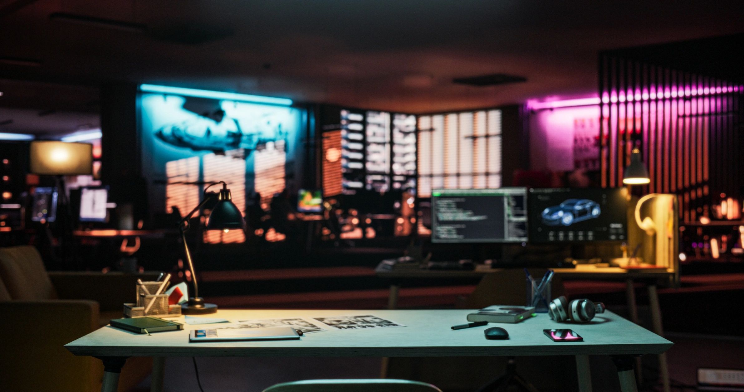 Neon-lit gaming room with desk setup